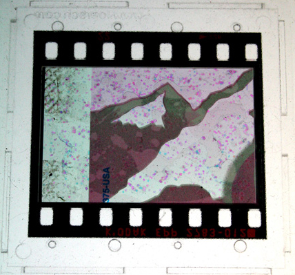 Clearchannel. 2007. mixed media transparency. 2 x 2 inches.