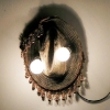 Chris Domenick. Leather hat, curtain tassles, lightbulbs, electricity.
